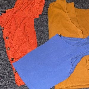 2 crop tops blue and orange with a tan dress.